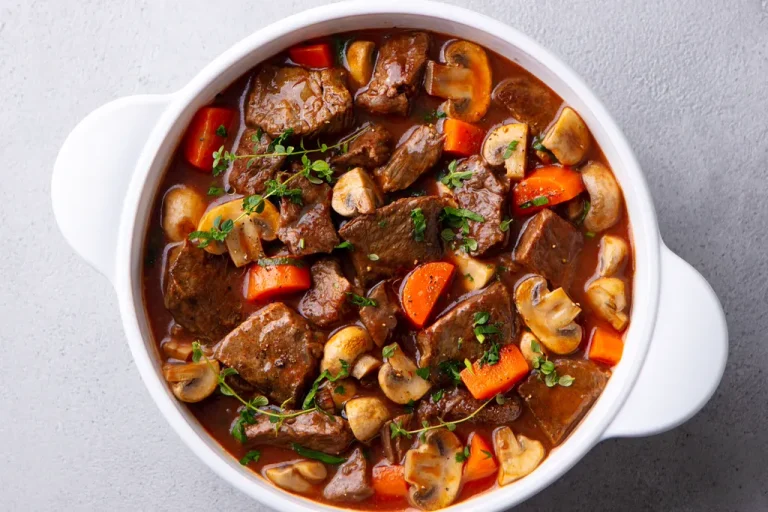 Beef bourguignon in a white bowl