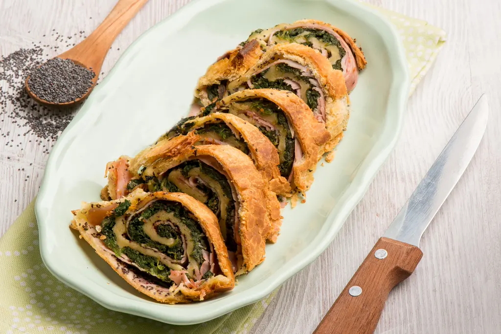 Sliced braciole served on an oval plate
