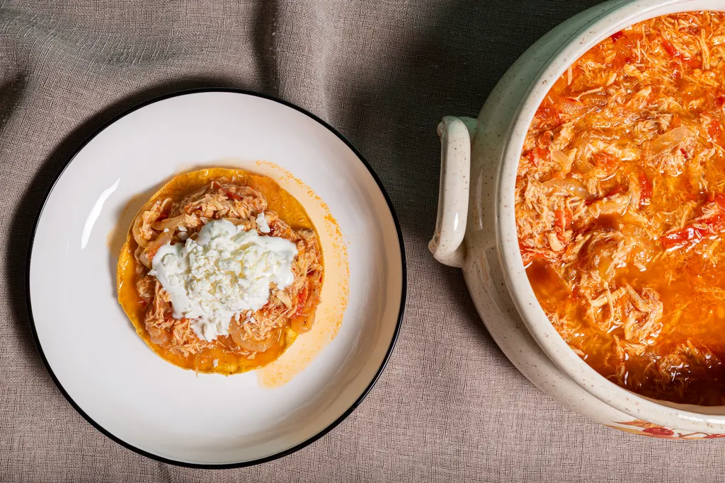 Shredded chicken with cream and crumbled cheese
