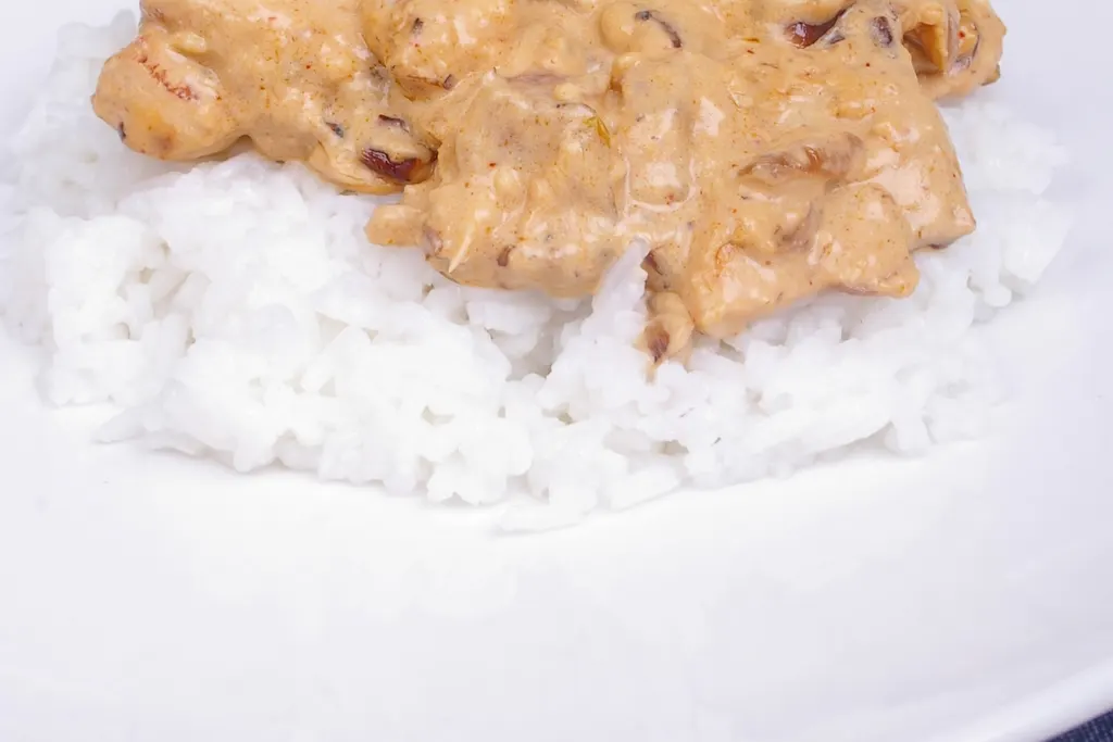 Creamy chicken served over white rice