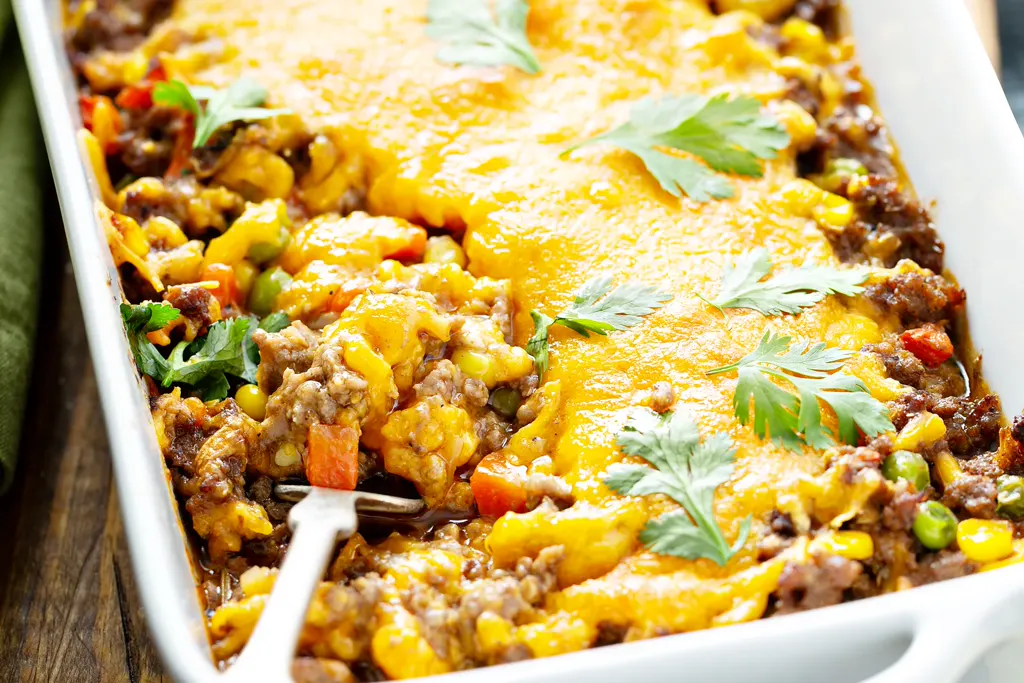 Cheesy beef and potato casserole in a baking dish