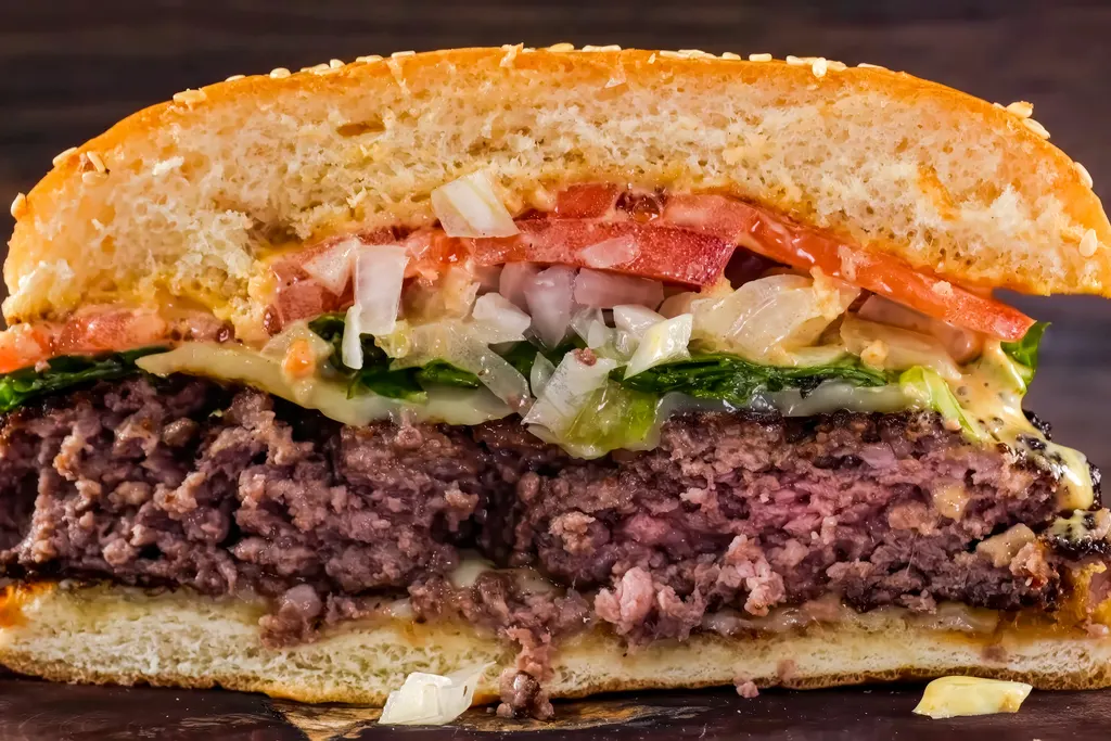 Juicy burger cut in half showing the cooked center