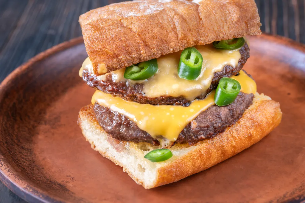 Double cheeseburger with fresh green jalapeños