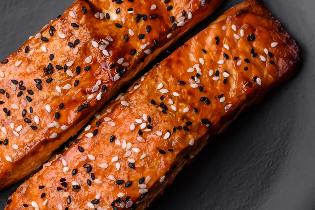 Honey-garlic glazed salmon fillets with sesame seeds