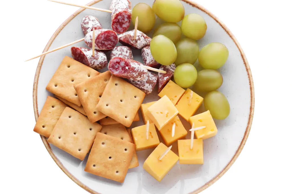 Loaded snack plate with cheese, crackers and fruit