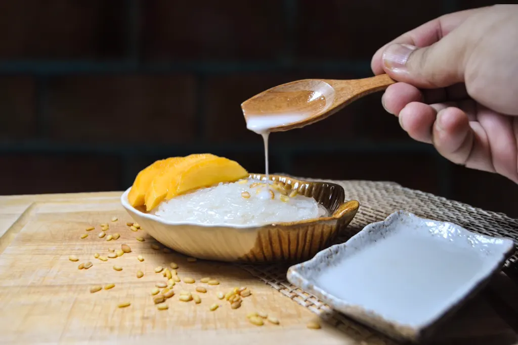 Salted coconut cream drizzled over mango sticky rice