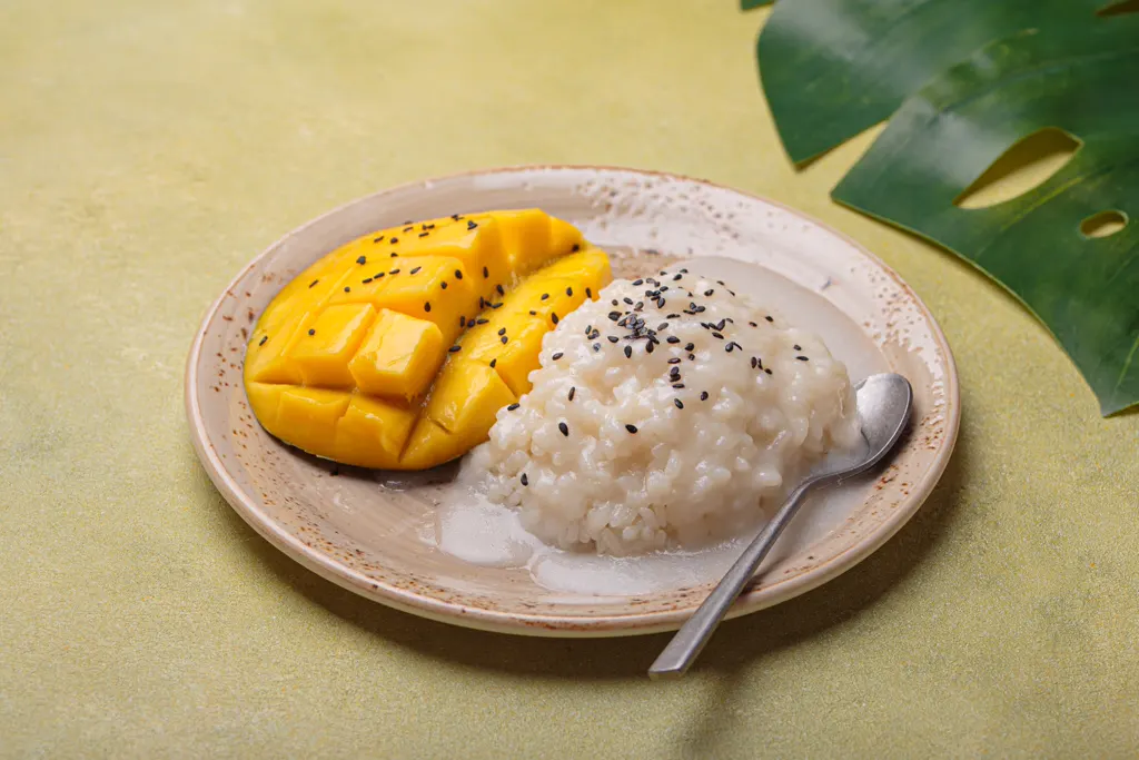 Mango sticky rice dessert with hedgehog-cut mango