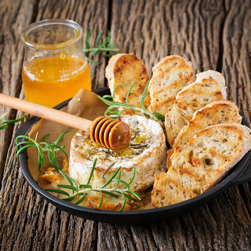 Baked ricotta cheese with honey and herbs