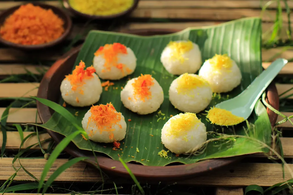 Sticky rice balls on a banana leaf