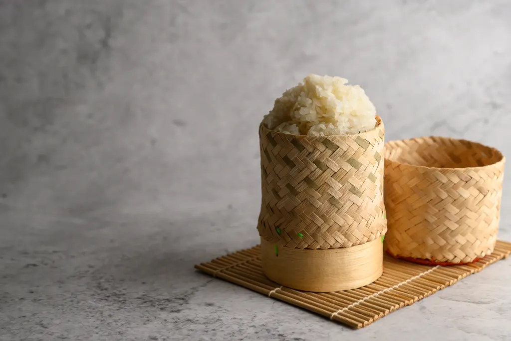 Steamed sticky rice in woven baskets
