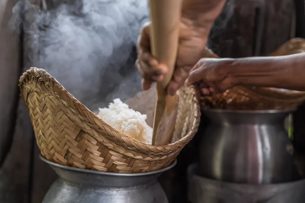 Sticky rice cooking on the stove